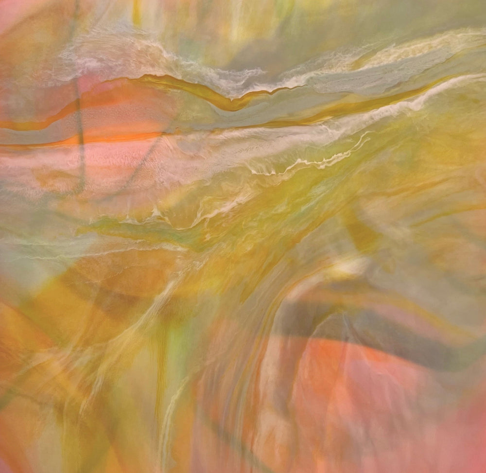 Abstract artwork with swirling colors in orange, yellow, and green.