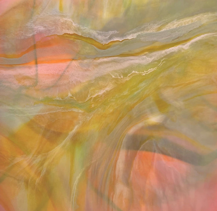 Abstract artwork with swirling colors in orange, yellow, and green.